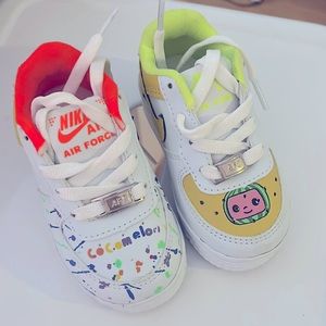 Nike Air Force 1 Cocomelon toddler sneakers.